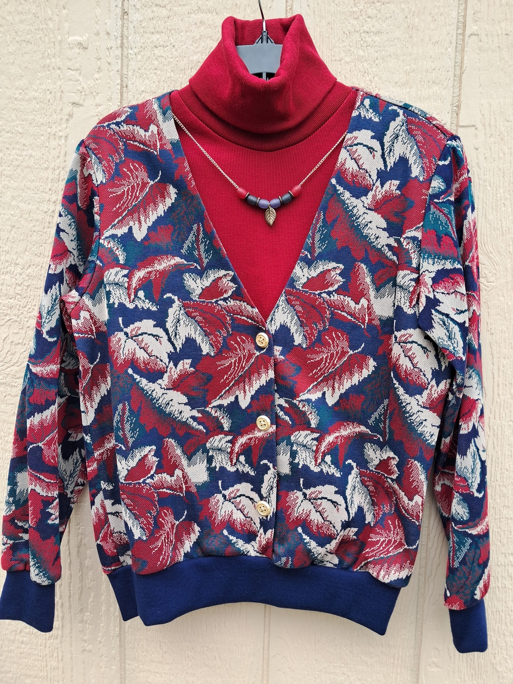 Alfred Dunner women's V-neck cardigan with an all-over leaf print. Front button